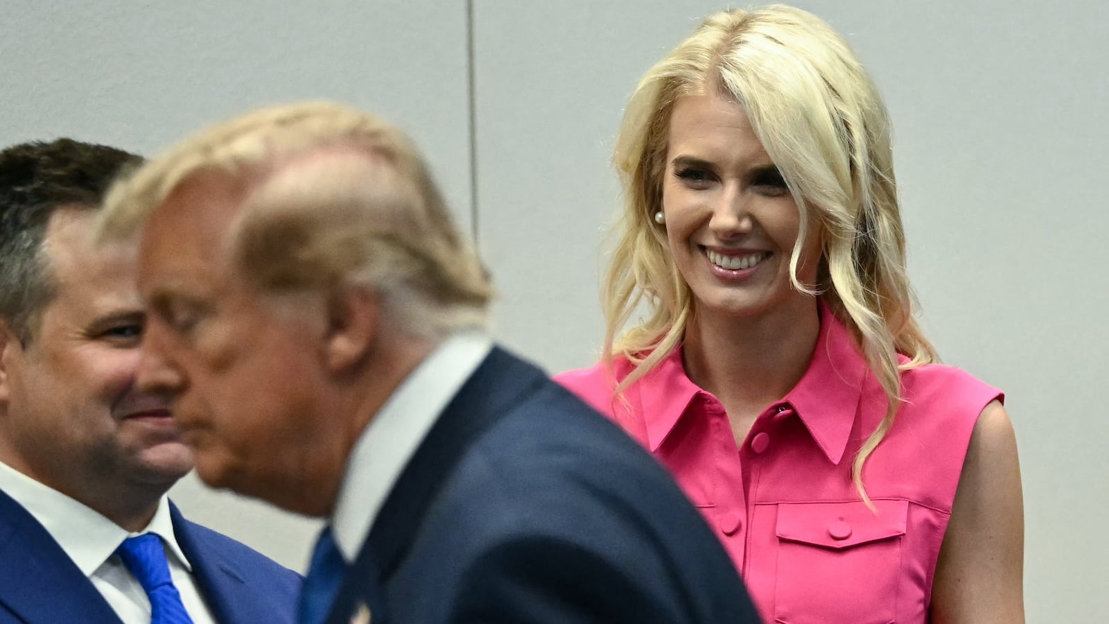 Natalie Harp, aide to US President Donald Trump, looks on as President Trump visits the Mission Control Center at NASA Lyndon B. Johnson Space Center in Houston, Texas, on August 28, 2026.