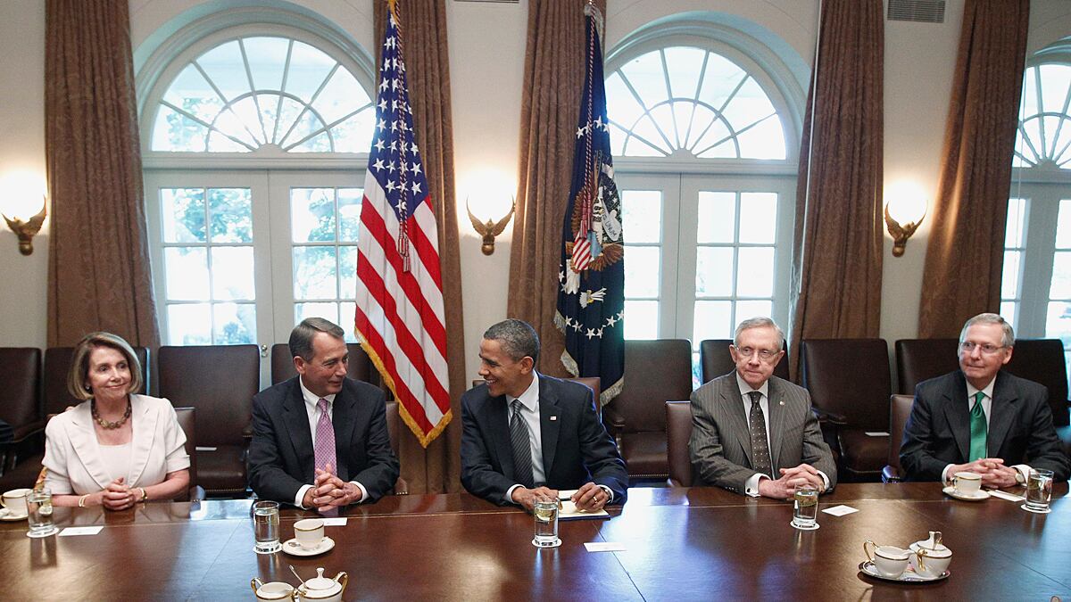 articles/2012/06/29/divided-government-slower-growth/debt-agreement-tomasky_af845u