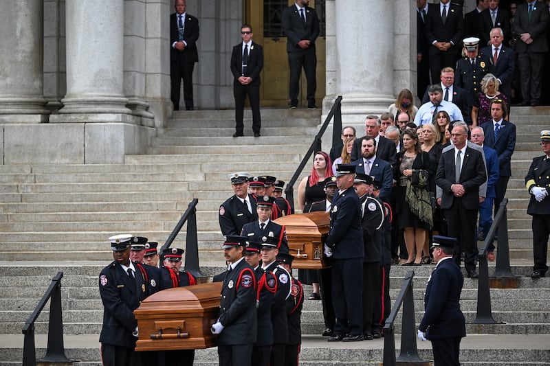 Family members follow behind the casket for Representative Melissa Hortman and her husband Mark Hortman