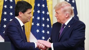 U.S. President Donald Trump shakes hands with the new Chairman of the Federal Reserve Kevin Warsh.