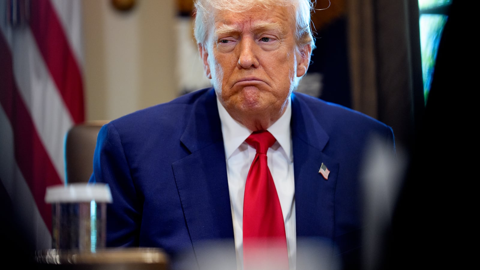 Donald Trump reacts to a question during a Cabinet meeting at the White House.