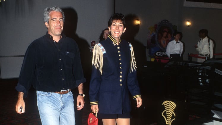 Jeffrey Epstein and Ghislaine Maxwell attend the “Batman Forever” premiere.