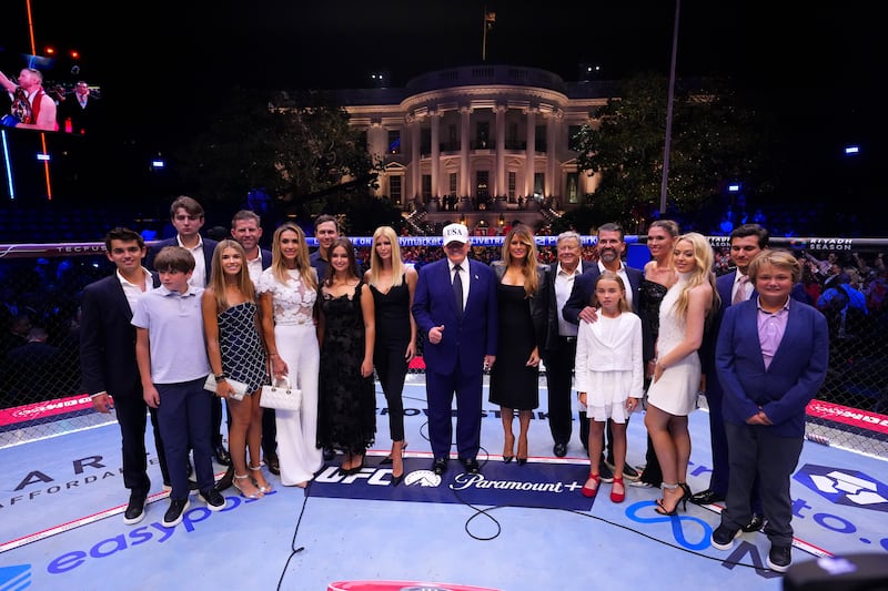 WASHINGTON, DC - JUNE 14: President Donald J. Trump and family pose for a photo in the Octagon after the UFC lightweight championship fight during the UFC Freedom 250 event on the South Lawn at the White House on June 14, 2026 in Washington, DC. (Photo by Jeff Bottari/Zuffa LLC)
