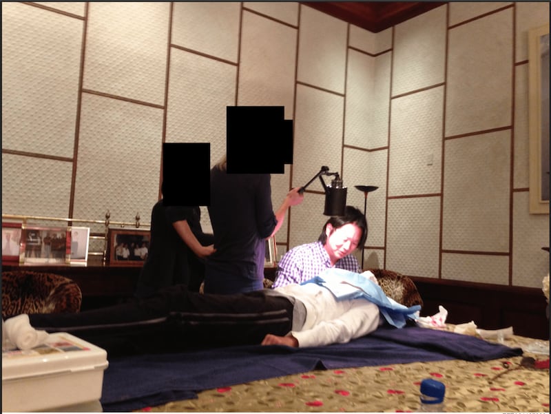 An image showing Dr. Jess Ting administering treatment to an unidentified woman.