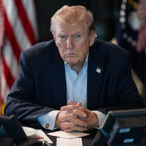 WASHINGTON DC, USA - MARCH 02: (----EDITORIAL USE ONLY â" MANDATORY CREDIT - 'THE WHITE HOUSE'S X ACCOUNT / HANDOUT' - NO MARKETING NO ADVERTISING CAMPAIGNS - DISTRIBUTED AS A SERVICE TO CLIENTS----) U.S. President Donald J. Trump sits at a table monitoring military operations during Operation Epic Fury against Iran, with U.S. flags visible behind him, in Washington, United States, on March 02, 2026. (Photo by The White House via X Account/Anadolu via Getty Images)