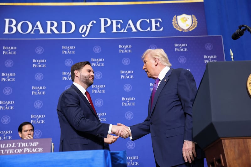 U.S. Vice President JD Vance shakes hands with President Donald Trump, as they and Secretary of State Marco Rubio attend the inaugural Board of Peace meeting at the U.S. Institute of Peace in Washington, D.C., U.S., February 19, 2026. REUTERS/Kevin Lamarque