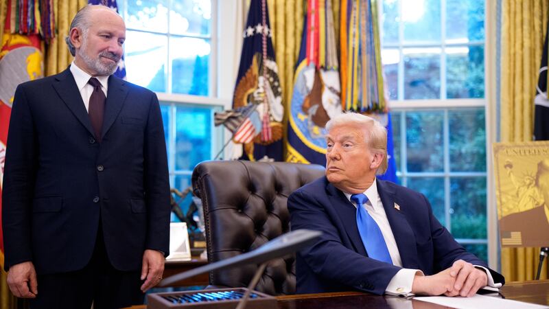 President Donald Trump, accompanied by U.S. Commerce Secretary Howard Lutnick
