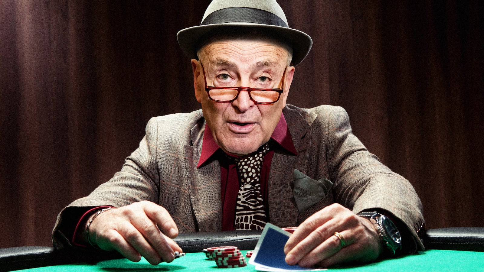 A photo illustration of Sen. Chuck Schumer playing poker.