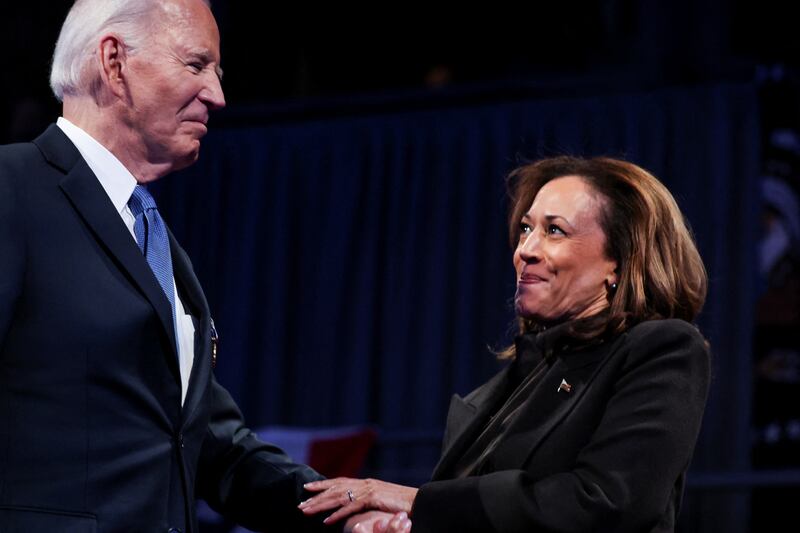 U.S. Vice President Kamala Harris looks at U.S. President Joe Biden as they attend a Department of Defense Commander in Chief farewell ceremony, at Joint Base Myers-Henderson Hall in Fort Myer, Virginia, U.S., January 16, 2025. REUTERS/Evelyn Hockstein