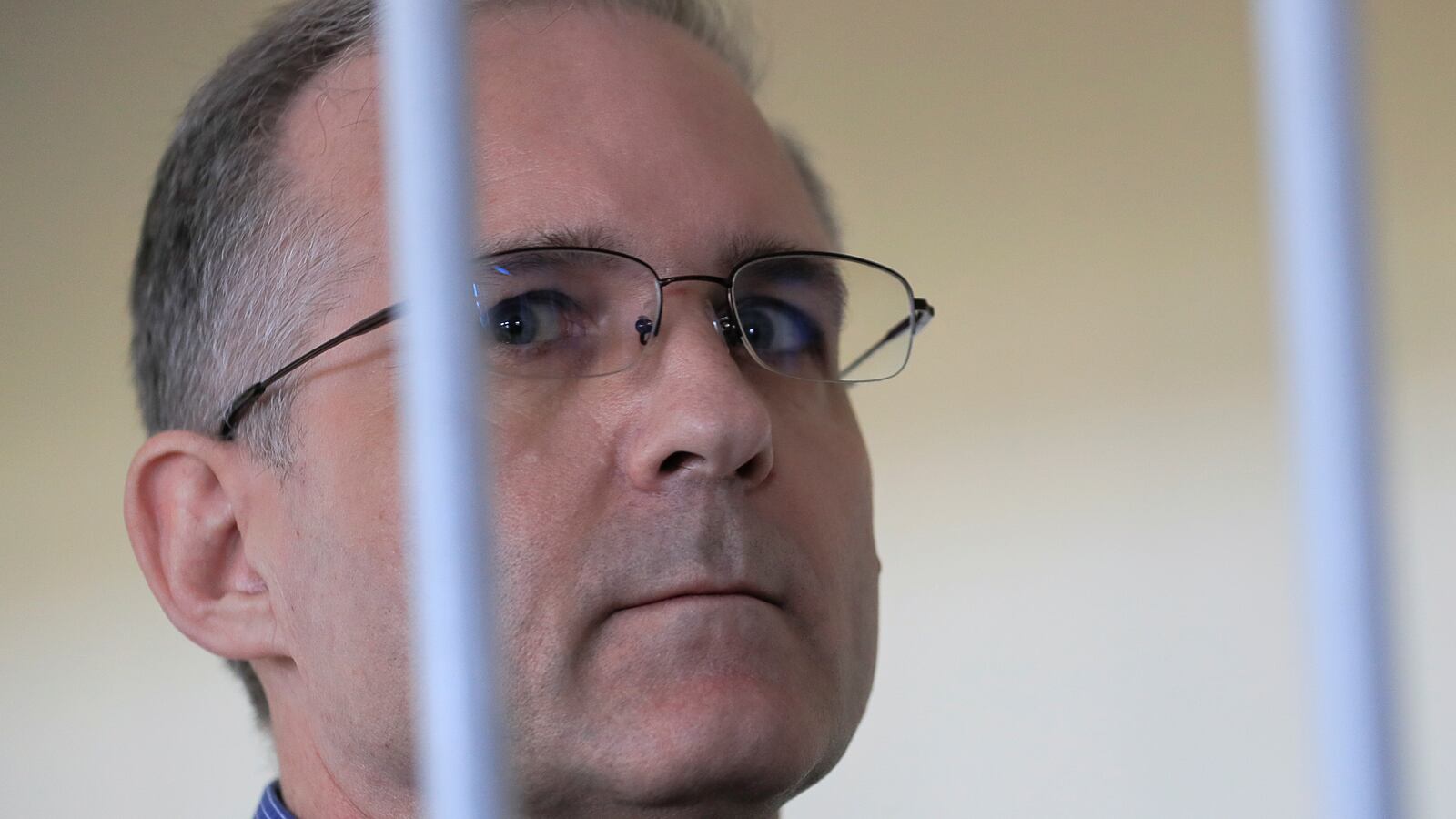 Paul Whelan stands in a “defendants” cage during a Russian court hearing in August 2019.