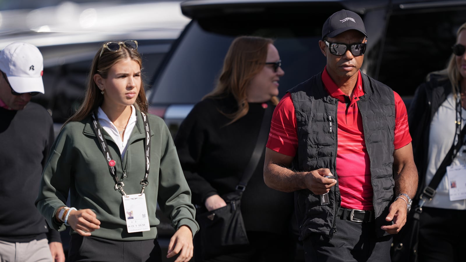 Kai Trump and Tiger Woods arrive to the course during the final round of The Genesis Invitational 2025 at Torrey Pines Golf Course on February 16, 2025 in La Jolla, California.