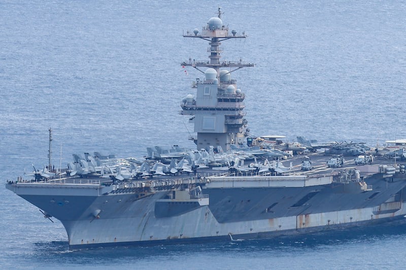 The world's largest aircraft carrier USS Gerald R. Ford arrives at Souda Bay naval base after having been part of Middle East war operations, on the island of Crete on March 23, 2026. The United States and Israel launched a massive air campaign against Iran in late February following a major US military buildup in the Middle East that included the Ford and another aircraft carrier, the Abraham Lincoln. (Photo by Costas METAXAKIS / AFP via Getty Images)