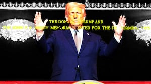 Donald Trump standing on a balcony at the Kennedy Center with the new name -- The Donald J. Trump John F. Kennedy Memorial Center for the Performing Arts