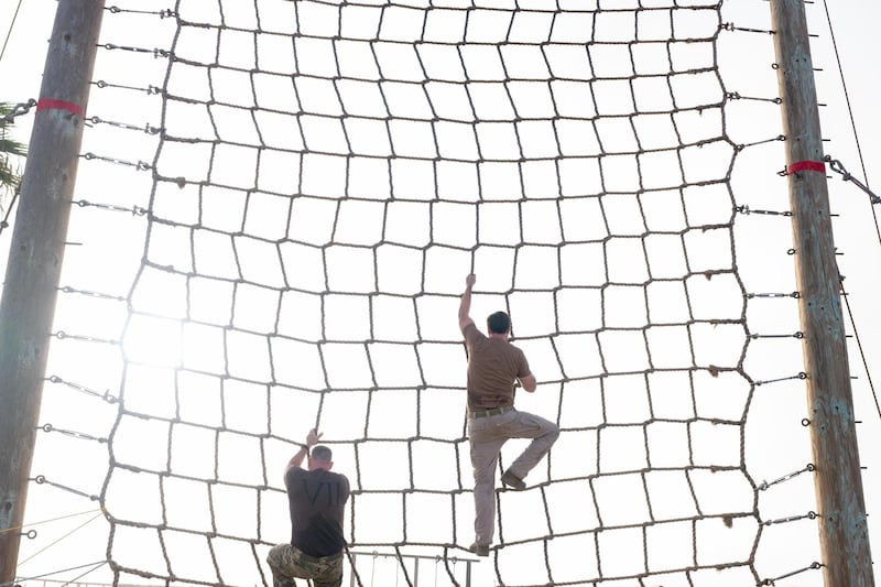 JD Vance posted a photo of himself climbing a rope wall with Navy SEALs.