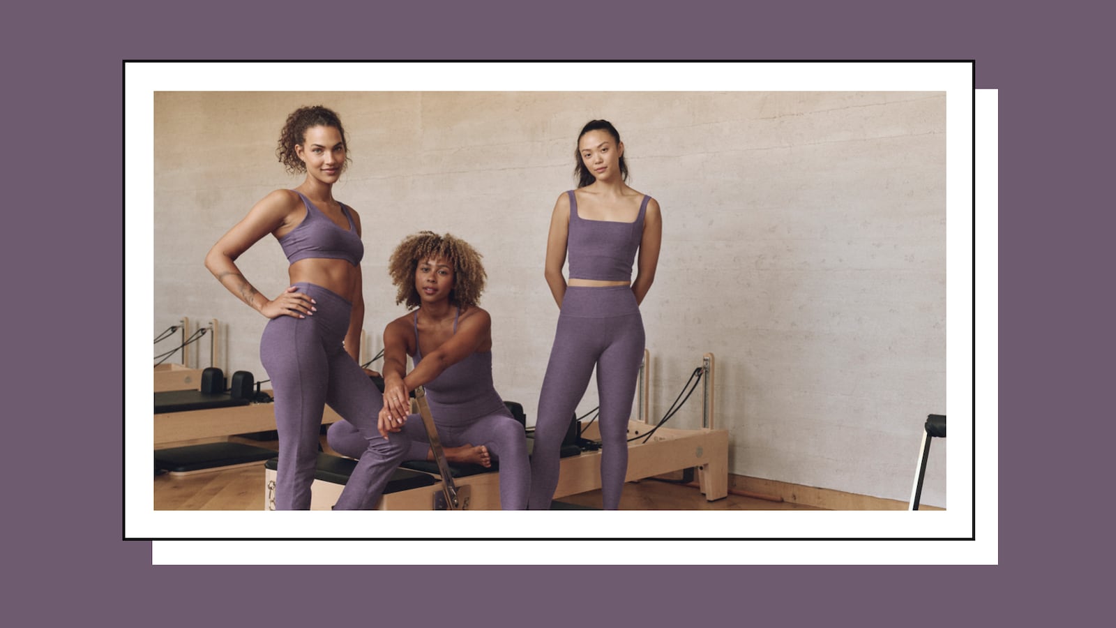 Three women wearing Beyond Yoga activewear in the gym.