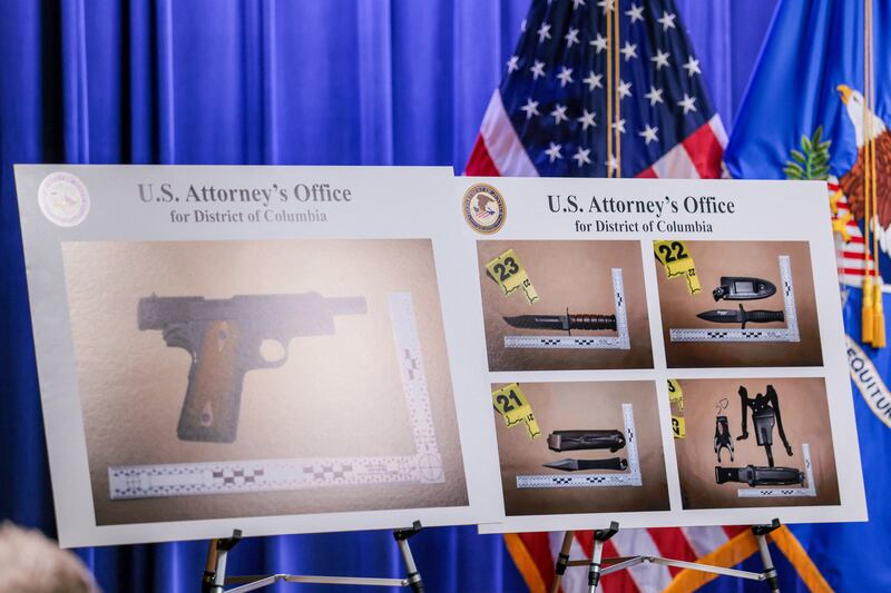 Pictures of the weapons carried by Cole Tomas Allen, the suspect in the shooting incident in Washington at the annual White House Correspondents' Association dinner, are displayed during a press conference at the U.S. Department of Justice about the shooting incident, in Washington, D.C., on April 27, 2026.