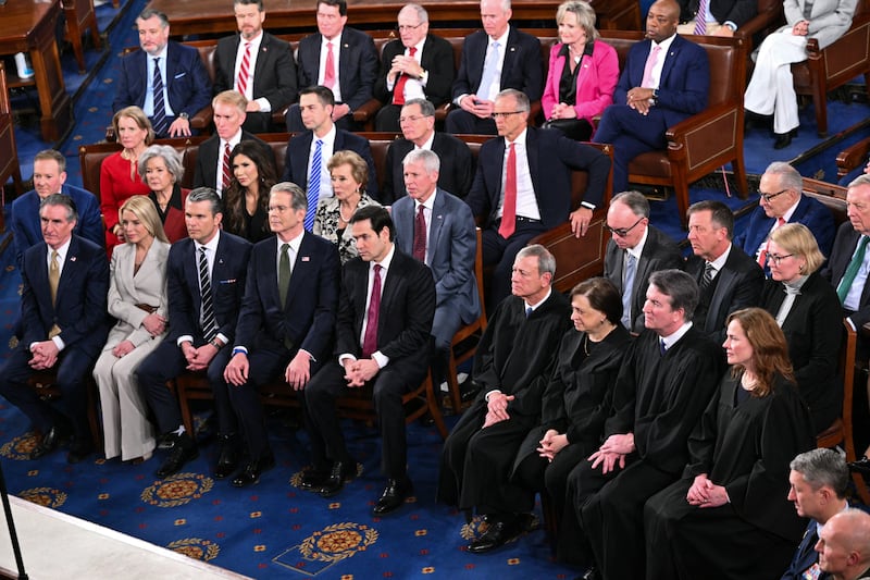 Supreme Court Chief Justice John Roberts along with Justices Elena Kagan, Brett Kavanaugh, and Amy Coney Barrett listen as President Donald Trump delivers the State of the Union address in the House Chamber of the US Capitol on February 24, 2026.