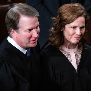 Supreme Court Justices Brett Kavanaugh and Amy Coney Barrett greet President Donald Trump after his address to a joint session of Congress in the House Chamber of the U.S. Capitol on Tuesday, March 4, 2025.
