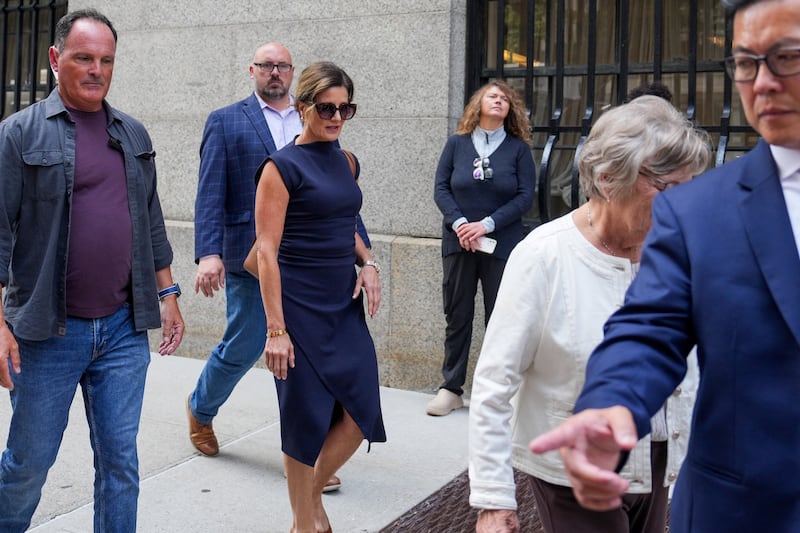 Brian Thompson’s wife, Paulette Thompson, exits the courtroom on Friday.