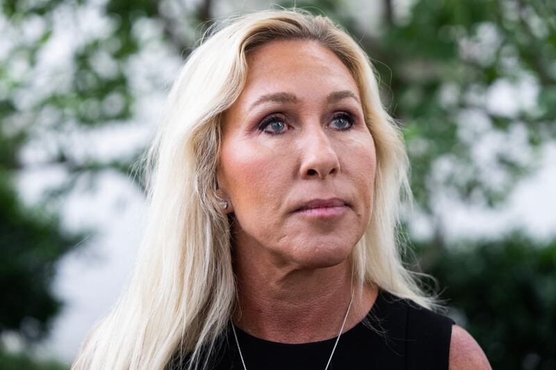 Rep. Marjorie Taylor Greene, R-Ga., talks with reporters outside the Capitol Hill Club on June 10, 2025.