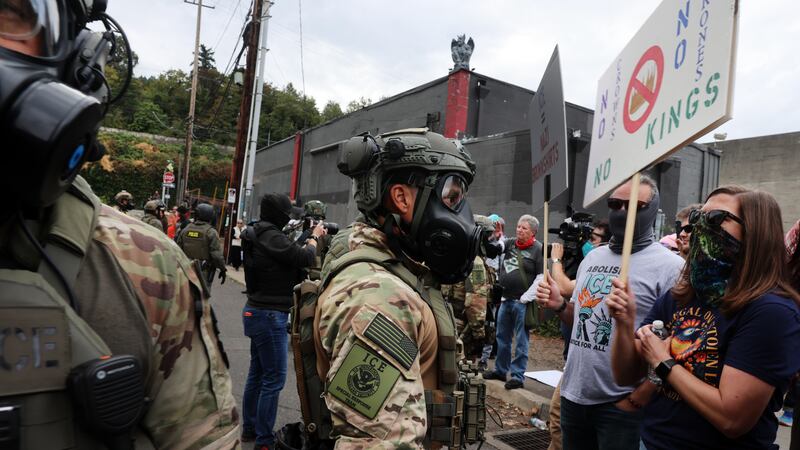 PORTLAND, OREGON - OCTOBER 04: Federal agents, including members of the Department of Homeland Security, the Border Patrol, and police, attempt to keep protesters back outside a downtown U.S. Immigration and Customs Enforcement (ICE) facility on October 04, 2025 in Portland, Oregon. The facility has become a focal point of nightly protests against the Trump administration and his announcement that he will be sending National Guard troops into Portland. A federal judge is currently hearing Oregon’s case against sending troops into the city, and a decision is expected on Saturday. (Photo by Spencer Platt/Getty Images)