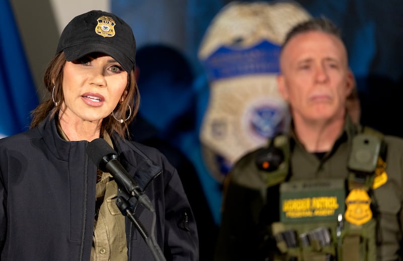MINNEAPOLIS, MN. - JANUARY 2026: Secretary of Homeland Security Kristi Noem during a press conference at the Bishop Henry Whipple Federal Building in Minneapolis, Minn., on Wednesday, January 7, 2026. Behind Noem is Border Patrol official, Gregory Bovino. The Department of Homeland Security confirmed that a woman, later identified as Renee Nicole Good, was shot and killed by an Immigration and Customs Enforcement (ICE) agent during a confrontation between federal agents and protesters in south Minneapolis earlier in the day. (Photo by Carlos Gonzalez/The Minnesota Star Tribune via Getty Images)