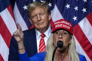 TOPSHOT - US Representative Marjorie Taylor Greene (R) speaks alongside former US President and 2024 presidential hopeful Donald Trump at a campaign event in Rome, Georgia, on March 9, 2024. (Photo by Elijah Nouvelage / AFP) (Photo by ELIJAH NOUVELAGE/AFP via Getty Images)