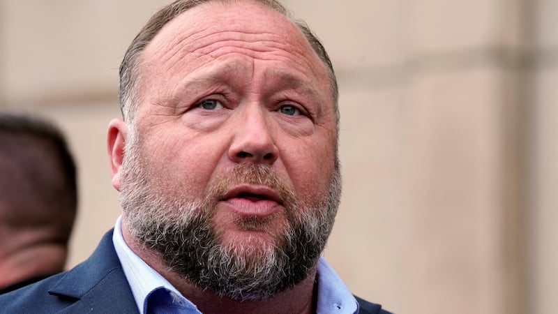 Alex Jones speaks to reporters at the court house as he faces a second defamation trial over Sandy Hook claims in Waterbury, Connecticut, U.S., September 22, 2022.   REUTERS/Michelle McLoughlin