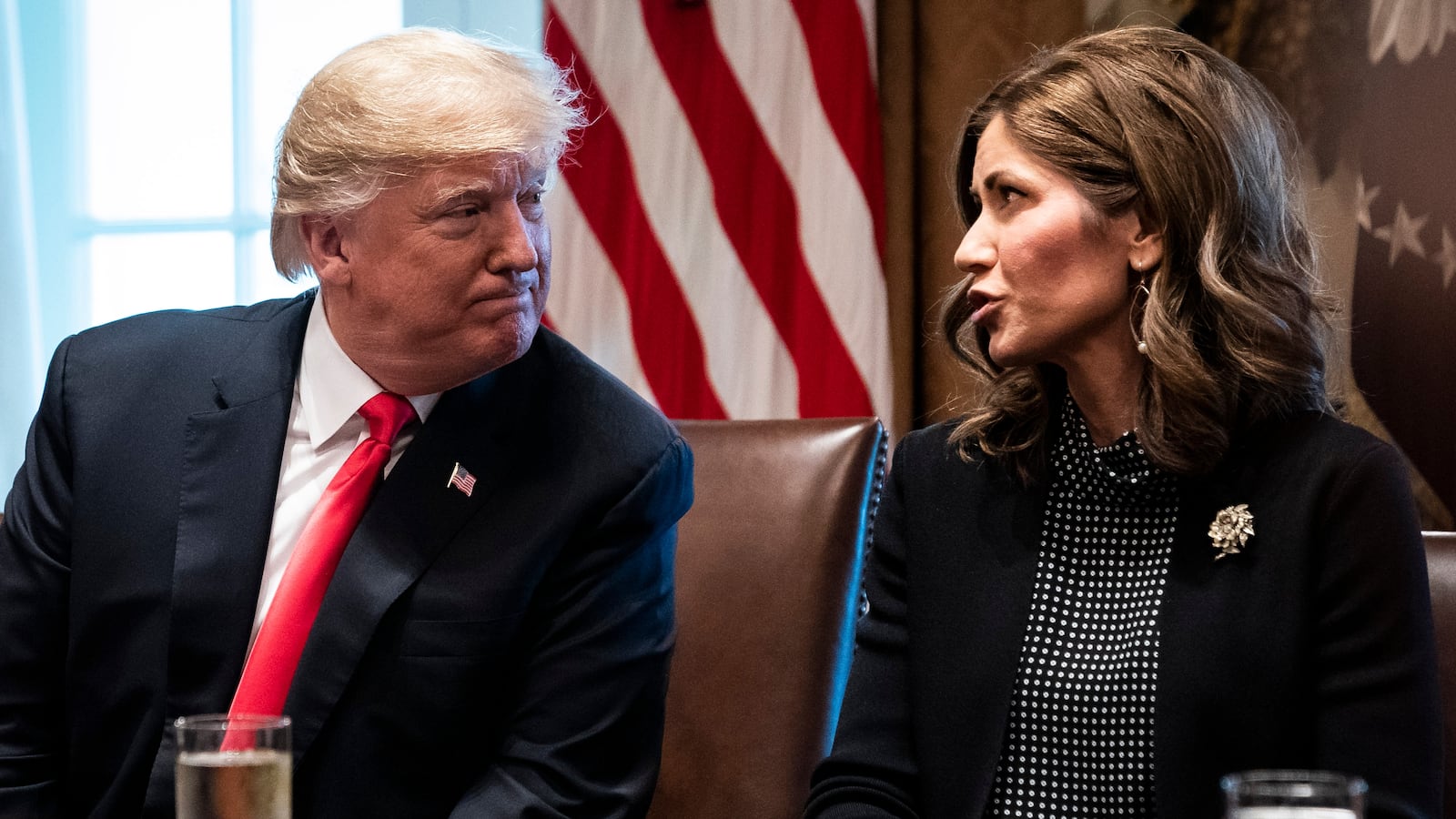 President Donald J. Trump speaks with Kristi Noem.