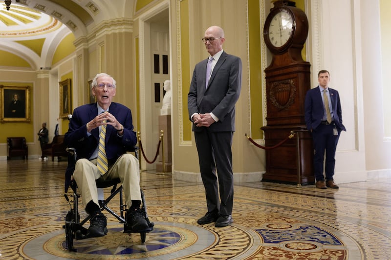 Senator Mitch McConnell remained in a wheelchair during his first public appearance since he was hospitalized more than 90 days ago.