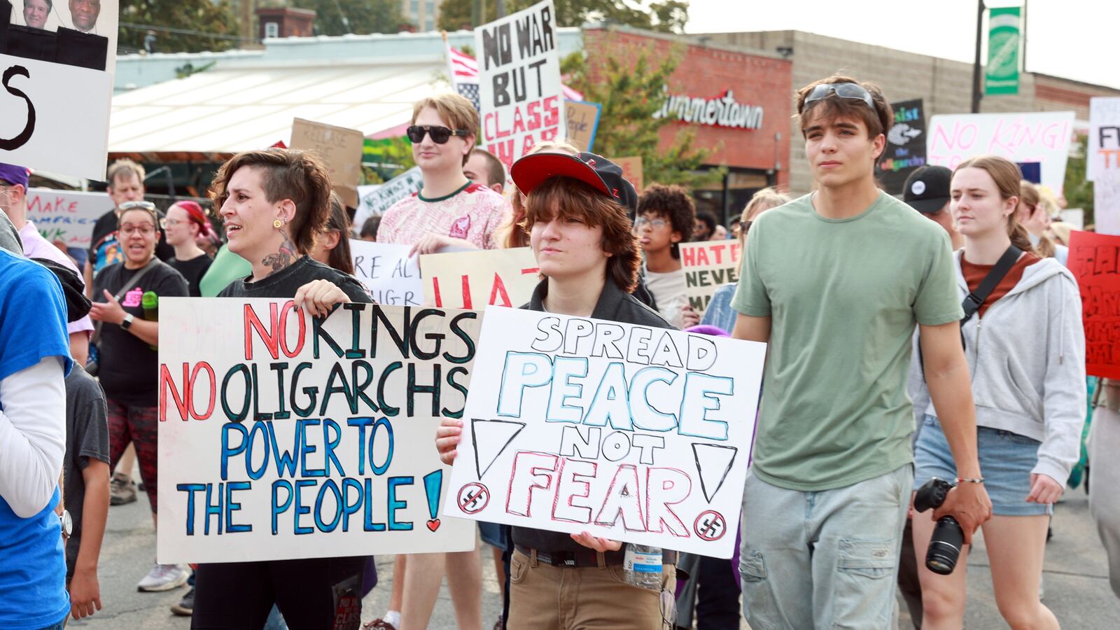 DETROIT, MICHIGAN-OCTOBER 18: Protestors march with signs and flags in a late afternoon No Kings 2.0 protest against the Trump Administration near Roosevelt Park in Detroit, Michigan USA, on Saturday, October 18, 2025.