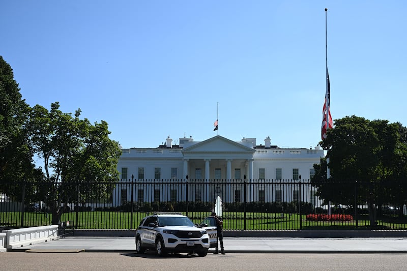 Members of the Secret Service block the street in front of the White House.