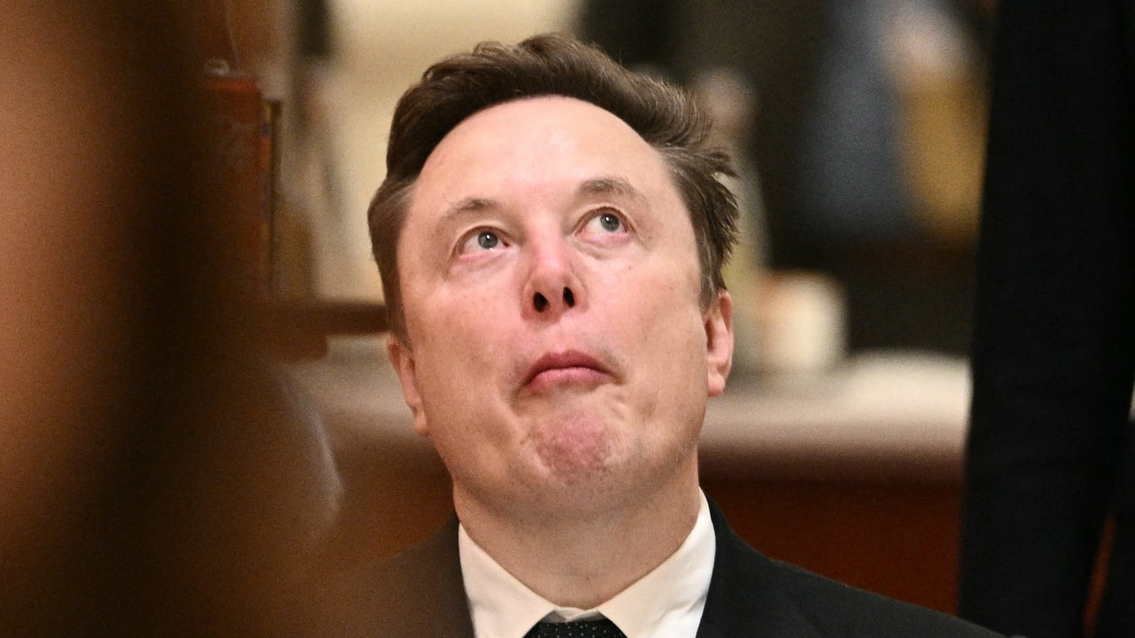 Tesla and SpaceX CEO Elon Musk reacts ahead of a state banquet for US President Donald Trump and China's President Xi Jinping at the Great Hall of the People Beijing on May 14, 2026. (Photo by Brendan SMIALOWSKI / AFP via Getty Images)