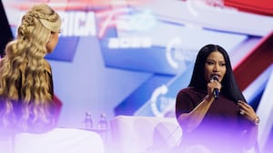 PHOENIX, ARIZONA - DECEMBER 21: Erika Kirk interviews surprise guest Nicki Minaj on the final day of Turning Point USA's annual AmericaFest conference at the Phoenix Convention Center on December 21, 2025 in Phoenix, Arizona. Minaj spoke about her frustrations with California Governor Gavin Newsom, and about why she has embraced the conservative movement. (Photo by Caylo Seals/Getty Images)
