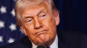 U.S. President Donald Trump listens during a press conference with Ukrainian President Volodymyr Zelensky following their meeting at Trump’s Mar-a-Lago club on December 28, 2025 in Palm Beach, Florida. Trump invited Zelensky to his private club to work on the U.S.-proposed peace plan to end the war in Ukraine, as the conflict approaches four years since the sudden full-scale invasion by Russia on February 24, 2022. (Photo by Joe Raedle/Getty Images)