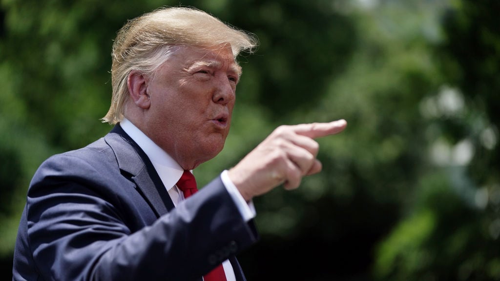 President Donald Trump talks with reporters before leaving the White House. (Photo by Chip Somodevilla/Getty Images)