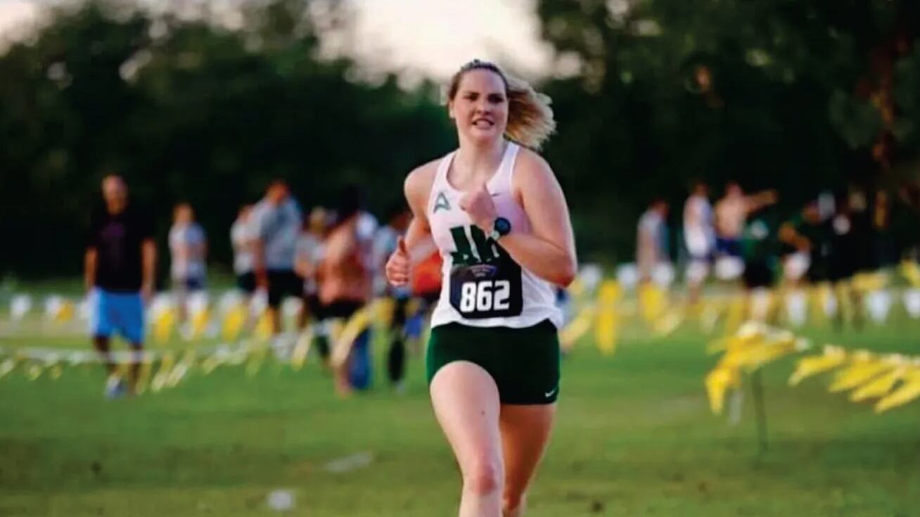 Julia Pernsteiner wears a cross country uniform as she competes in a race