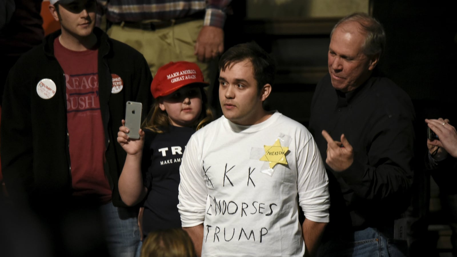 cheats/2016/02/27/trump-protester-with-kkk-t-shirt-ejected/160227-trump-rally-cheat_v3icqc