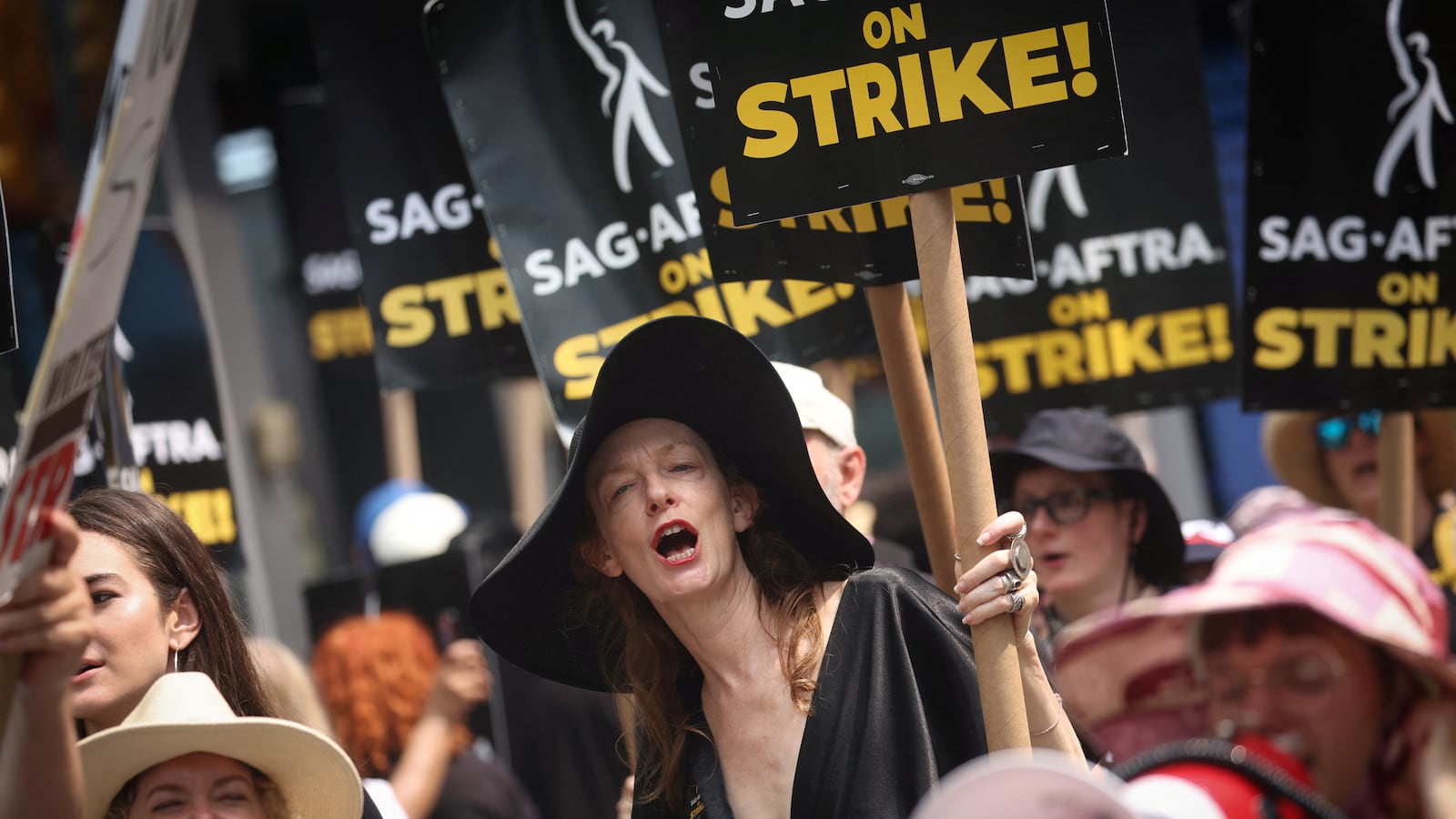 Director and writer Deborah Kampmeier joins SAG-AFTRA actors and Writers Guild of America writers on the picket line while on strike in Times Square in New York City.