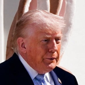 President Donald Trump, standing next to the Easter Bunny, attends the 2026 White House Easter Egg Roll at the White House in Washington, D.C., U.S., April 6, 2026.