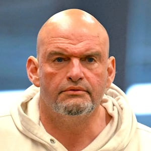 U.S. Senator John Fetterman (D-PA) walks to the chamber as senators grapple with making a deal to fund the U.S. government and avert a shutdown, on Capitol Hill in Washington, D.C., U.S., March 14, 2025.