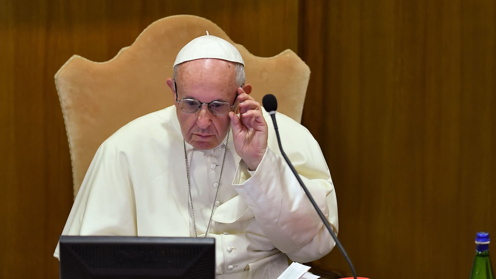 Pope Francis checks a computer screen during the Synod of Bishops, focusing on Young People, the Faith and Vocational Discernment, on October 3, 2018 at the Vatican.