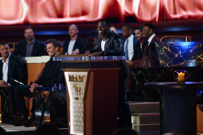 Tom Brady, Kevin Hart at G.R.O.A.T. The Greatest Roast Of All Time: Tom Brady for the Netflix is a Joke Festival at the Kia Forum on Sunday, May 5, 2024 in Inglewood, CA. Cr. Kevin Kwan/Netflix © 2024