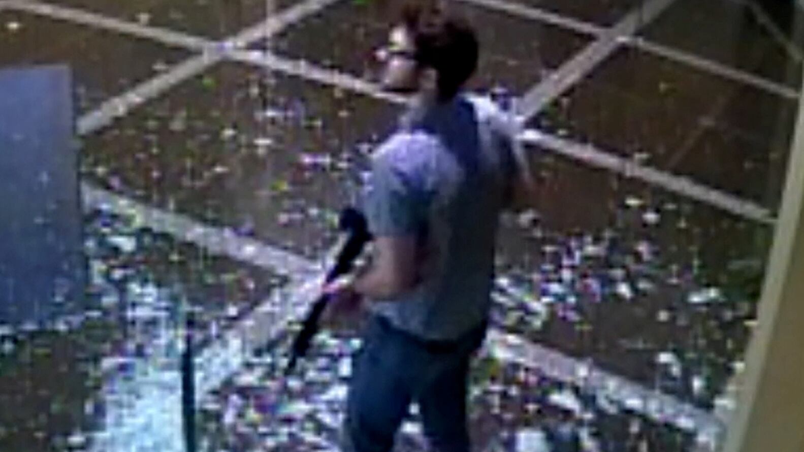 The suspect of a mass shooting stands inside Old National Bank in downtown Louisville, Kentucky