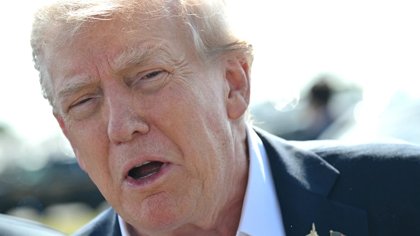 Donald Trump speaks to the press upon arrival at Republic Airport in Farmingdale, New York, on September 26, 2025.