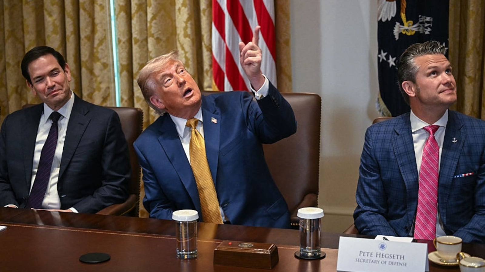 President Donald Trump (C) makes comments about new decor in the room as Secretary of Defense Pete Hegseth (R) and Secretary of State Marco Rubio (L) look on during a cabinet meeting in the Cabinet Room of the White House in Washington, DC, on July 8, 2025. (Photo by ANDREW CABALLERO-REYNOLDS / AFP) (Photo by ANDREW CABALLERO-REYNOLDS/AFP via Getty Images)