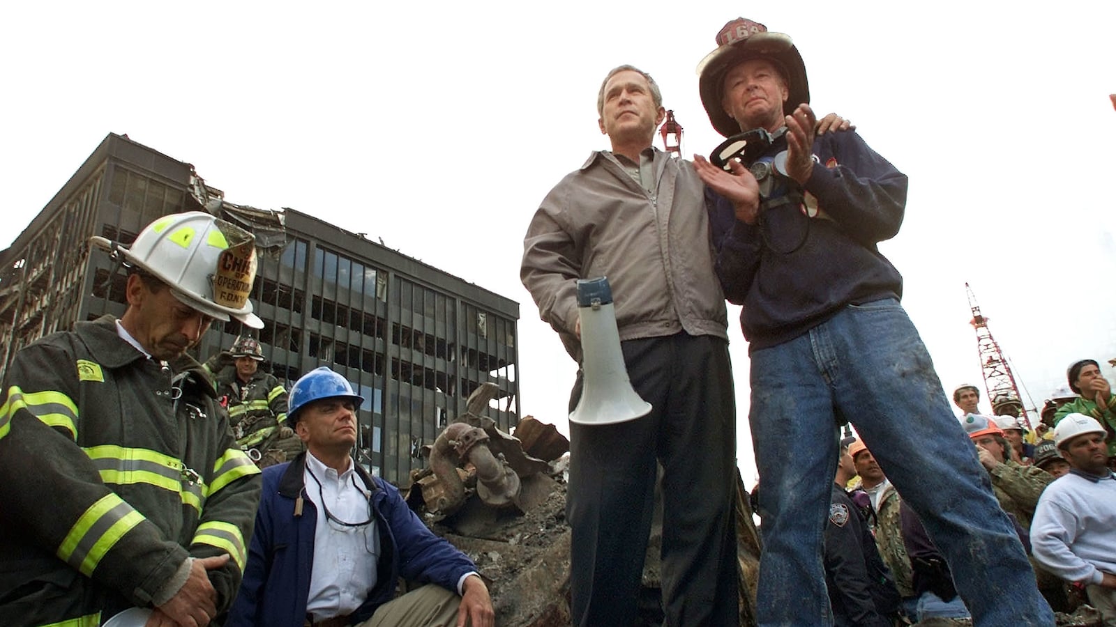 U.S. President George W. Bush talks to retired firefighter Bob Beckwith