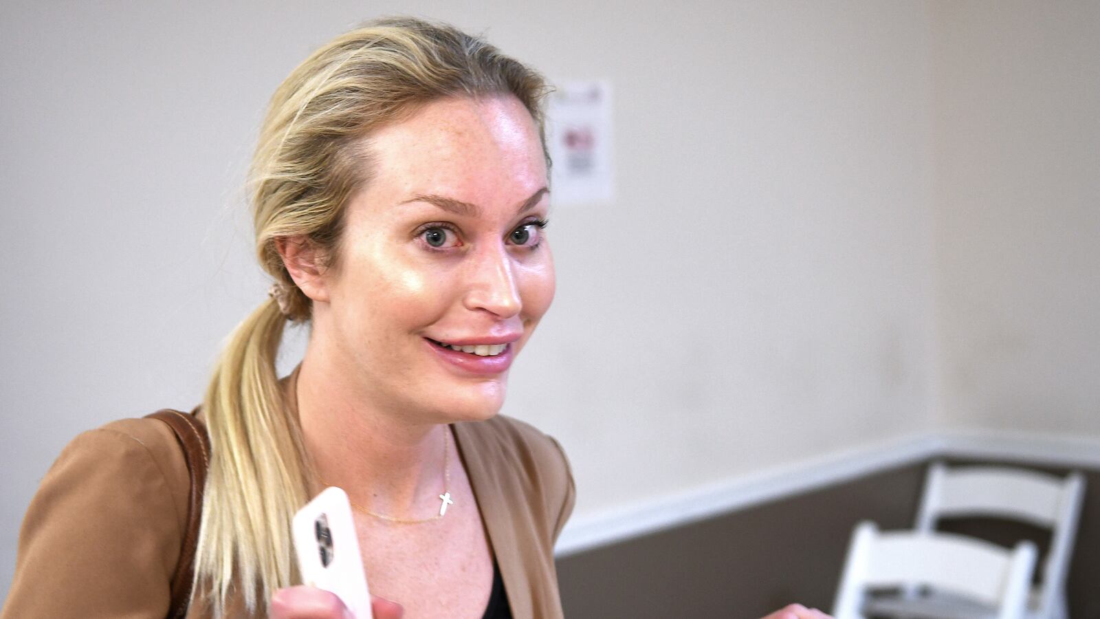 Christina Pushaw, Press Secretary for Florida Governor Ron DeSantis, attends a press conference.