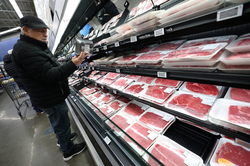 A customer shops for beef at a Walmart Supercenter retail store in North Bergen, New Jersey, U.S., November 21, 2025.