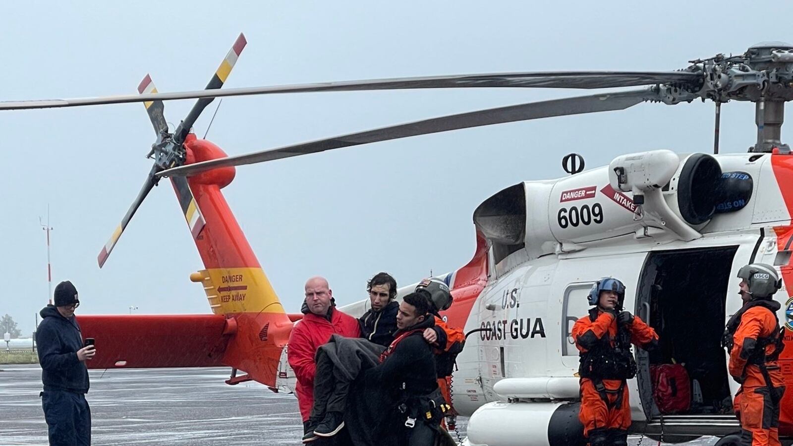 U.S. Coast Guard transport Jericho Labonte after rescuing him from a capsized vessel off the coast of Oregon.
